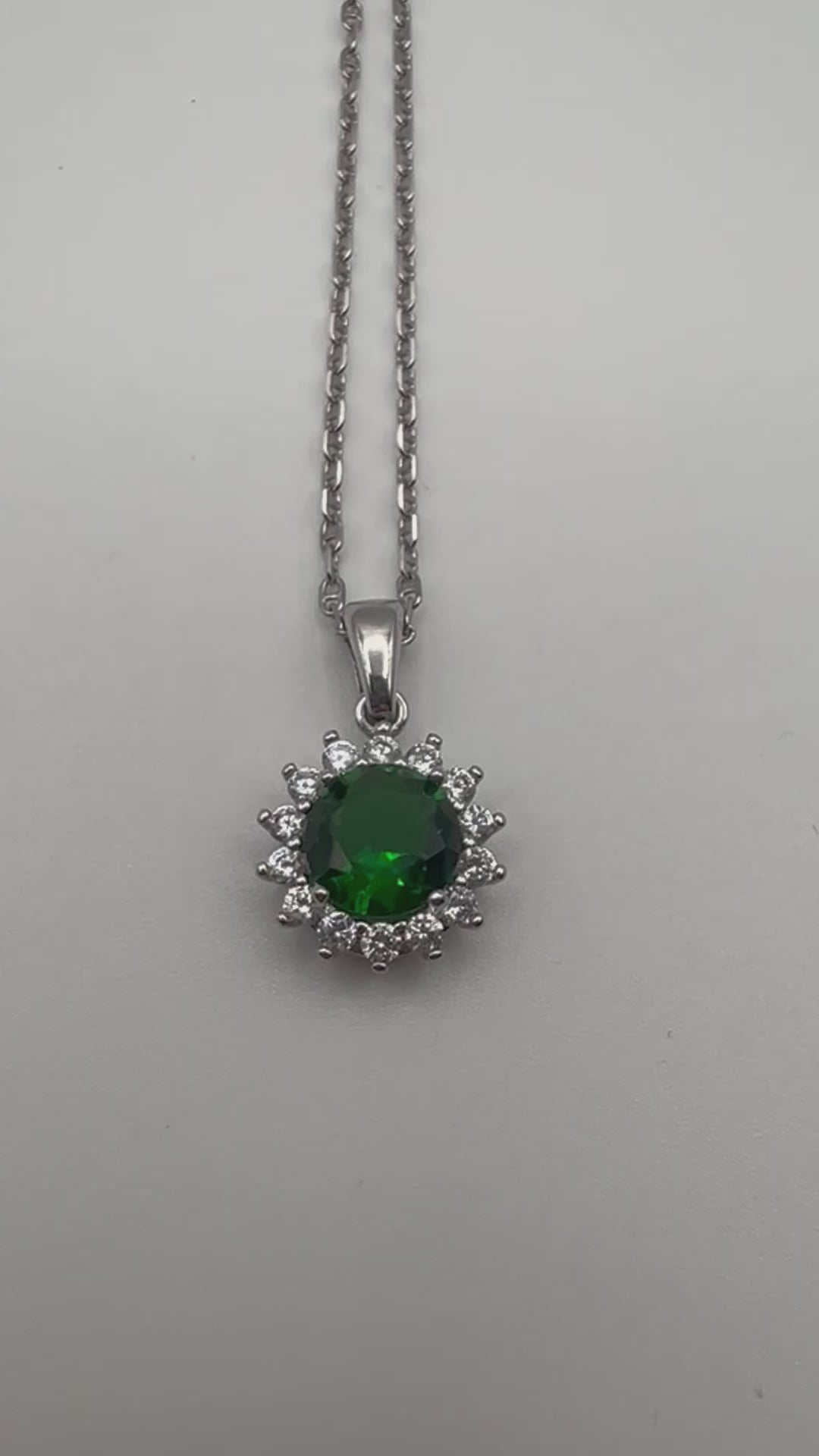 Sterling silver necklace with green crystal pendant